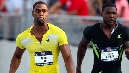 Tyson Gay (à gauche) et Justin Gatlin (à droite), en 2013 (CHRISTIAN PETERSEN / GETTY IMAGES NORTH AMERICA)