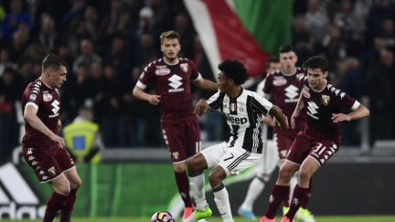 La Juventus et le Torino dos à dos lors du derby (MIGUEL MEDINA / AFP)