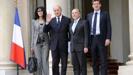 Laurent Fabius et ses ministres délégués (Benguigui, Cazeneuve, Canfin) (AFP)