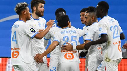 Les joueurs de l'Olympique de Marseille.  (CLEMENT MAHOUDEAU / AFP)