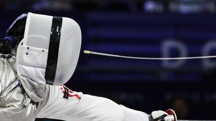 En pleine face. La Hongkongaise Yu Chui Yee face à l'Espagnole Judith Rodriguez Menendez, le 4 septembre sous la verrière du Grand Palais. (THIBAUD MORITZ / AFP)