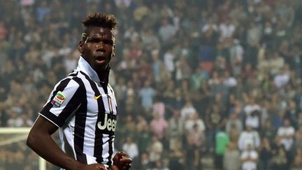 Paul Pogba, 21 ans, et maître à jouer de la Juve et des Bleus.  (GIUSEPPE CACACE / AFP)