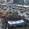 Des Syriens célèbrent la chute du régime Assad, lundi 9 décembre à Damas, sur une place de la ville. (OMAR HAJ KADOUR / AFP)