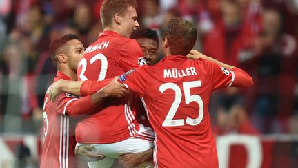 Le bonheur des Bavarois autour de Kimmich et Muller (CHRISTOF STACHE / AFP)