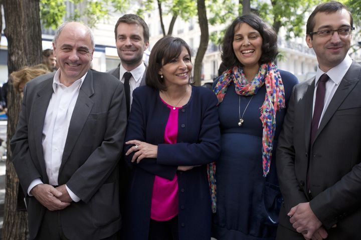 Myriam El Khomri aux côtés d'Anne Hidalgo, le 4 juin 2013, au début de la campagne pour les élections municipales à Paris. (JOEL SAGET / AFP)