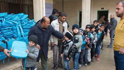 Réouverture d'écoles dans les quartiers Est de Mossoul, le 22 janvier 2017. (UNICEF/UN049560/Ramadhan)