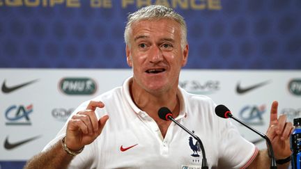  (Didier Deschamps, tout sourire, après la victoire face à la Suisse © REUTERS/Charles Platiau)