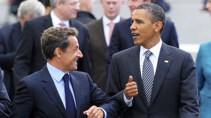 Nicolas Sarkozy, alors président de la République, et son homologue américain Barack Obama à Deauville (Calvados), le 26 mai 2011. (PHILIPPE WOJAZER / AFP)