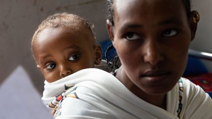 A mother and her baby wait to receive treatment at a hospital in Mekele, the capital of Ethiopia's Tigray region, where women have been raped by soldiers, according to a UN report.  (XIMENA BORRAZAS / MAXPPP)