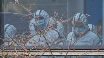 Des&nbsp;équipes&nbsp;de&nbsp;l'OMS enquêtent sur les origines du Covid-19 à Wuhan, en Chine, le 2 février 2021. (HECTOR RETAMAL / AFP)