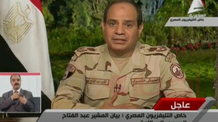 Le mar&eacute;chal Al-Sissi annonce sa candidature &agrave; l'&eacute;lection pr&eacute;sidentielle dans une allution &agrave; la t&eacute;l&eacute;vision &eacute;gyptienne, mercredi 26 mars 2014. (EGYPTIAN AL-MASRIYA TV / AFP)