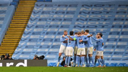 La joie des joueurs de Manchester City, qualifiés pour la finale de la Ligue des champions après avoir éliminé le PSG mardi 4 mai 2021. (PAUL ELLIS / AFP)