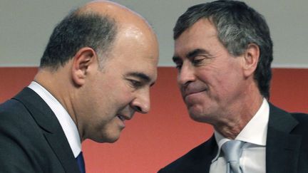 Les ministres Pierre Moscovici (G) et J&eacute;r&ocirc;me Cahuzac, le 28 septembre 2012 &agrave; Paris. (CHRISTOPHE ENA / SIPA)