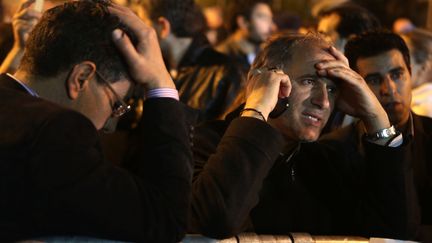 Des employ&eacute;s de la banque chypriote Laiki durant une manifestation pr&egrave;s du Parlement, &agrave; Nicosie (Chypre), le 21 mars 2013.&nbsp; (PATRICK BAZ / AFP)