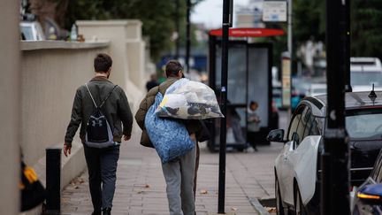 Like these prisoners, about 1,750 inmates have been released in Britain, as part of a government release programme aimed at reducing overcrowding in prisons in England and Wales. (TOLGA AKMEN/MAXPPP)