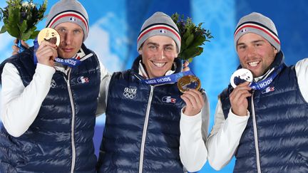 Les Fran&ccedil;ais auteurs d'un tripl&eacute; historique en skicross, Jean-Fr&eacute;d&eacute;ric Chapuis (1er), Arnaud Bovolenta (2e) et Jonathan Midol (3e), sur le podium des JO d'hiver de Sotchi (russie), le 20 f&eacute;vrier 2014. (LOIC VENANCE / AFP)