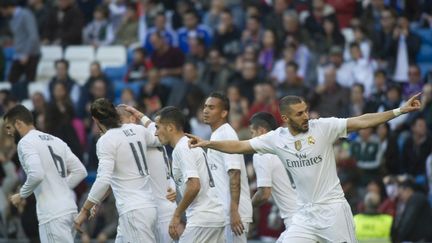 Auteur d'un doublé avec le Real Madrid, Karim Benzema a paru imperturbable... (CURTO DE LA TORRE / AFP)