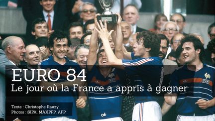 Victorieux de l'Espagne en finale de l'Euro 84, les Français Michel Platitni, Alain Giresse, Luis Fernandez et Bruno Bellone brandissent le trophée au Parc des Princes à Paris, le 27 juin 1984. (LEHR / SIPA)