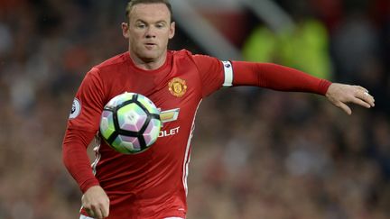 Wayne Rooney fidèle au maillot rouge de Manchester (OLI SCARFF / AFP)