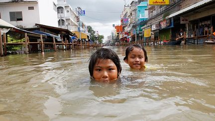 La planète se réchauffe: conséquence ou pas, les catastrophes naturelles se multiplient. Le débat divise les scientifiques. VOIR LE DIAPORAMA (REUTERS / Sukree Sukplang)