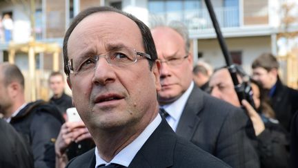 Fran&ccedil;ois Hollande lors de son d&eacute;placement &agrave; Dijon (C&ocirc;te-d'Or), le 11 mars 2013, avec le maire Fran&ccedil;ois Rebsamen. (ERIC FEFERBERG / AFP)