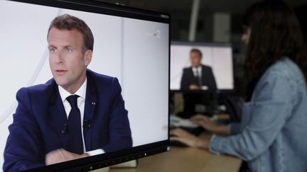 Emmanuel Macron lors d'une interview accordée à France 2 et TF1, le 14 juillet 2020. (STEFANO RELLANDINI / AFP)