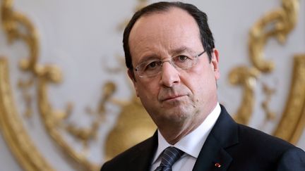 Fran&ccedil;ois Hollande avant le Conseil des ministres de rentr&eacute;e, le 3 janvier 2014, &agrave; l'Elys&eacute;e, &agrave; Paris. (PHILIPPE WOJAZER / AFP)