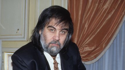 Le compositeur grec Vangelis dans son appartement parisien, le 9 juin 1991. (ROB VERHORST / REDFERNS / GETTY IMAGES)