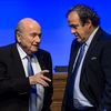 Le président de la Fifa, Sepp Blatter, et le président de l'UEFA, Michel Platini, le 11 juin 2014 à Sao Paulo (Brésil). (FABRICE COFFRINI / AFP)