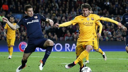 Lucas Hernandez (à gauche) à la lutte avec Sergi Roberto lors du match aller des quarts de finale de la Ligue des champions.  (JOAN VALLS / NURPHOTO)