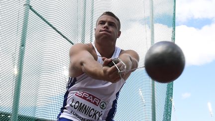 Le Slovaque Marcel Lomnicky s'appr&ecirc;te &agrave; lancer son marteau, le 16 ao&ucirc;t 2014. (FRANCK FIFE / AFP)