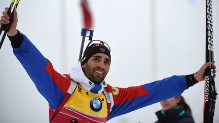 Le biathlète français, Martin Fourcade, peut savourer après son troisième titre mondial en trois courses... (HENDRIK SCHMIDT / DPA)