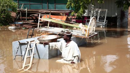 Inondations dans le village de Wad Ramli, à 50 km de Khartoum, sur la rive est du Nil.&nbsp; (EBRAHIM HAMID / AFP)