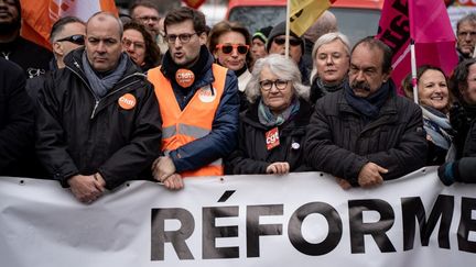 Laurent Berger, le chef de file de la CFDT (à gauche), et Philippe Martinez, le numéro un de la CGT (à droite), lors d'une manifestation contre la réforme des retraites, à Paris, le 11 mars 2023. (NICOLAS LIPONNE / HANS LUCAS / AFP)