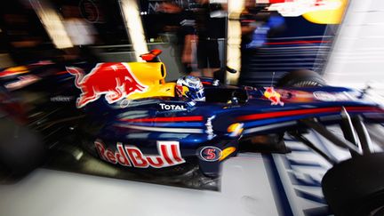 Sebastian Vettel (Red Bull) sort de son stand (MARK THOMPSON / GETTY IMAGES ASIAPAC)