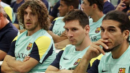 Carles Puyol, Lionel Messi et José Pinto, les joueurs du FC Barcelone