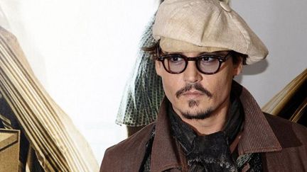 Johhny Depp est un fan de livres. Il présentait ici le film Rhum Express, tiré d&#039;un roman de Hunter S. Thompson (Paris, novembre 2011)
 (François Guillot / AFP)