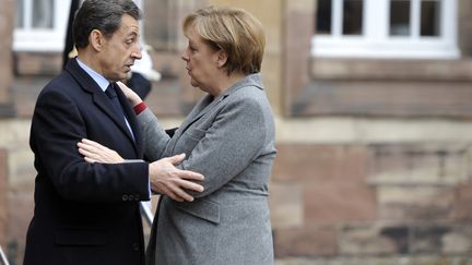 Nicolas Sarkozy et la chanceli&egrave;re allemande Angela Merkel, &agrave; Strasbourg le 24 novembre 2011. (ERIC FEFERBERG / AFP)