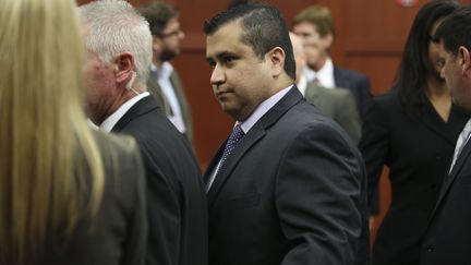 George Zimmerman quitte le tribunal avec sa famille après qu'un jury l'a déclaré non coupable à Sanford (Floride), le 13 juillet 2013. (POOL / GETTY IMAGES NORTH AMERICA / AFP)