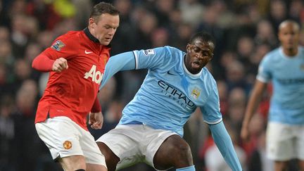 Wayne Rooney, meilleur buteur de l'histoire du derby, devrait débuter la partie. (PAUL ELLIS / AFP)