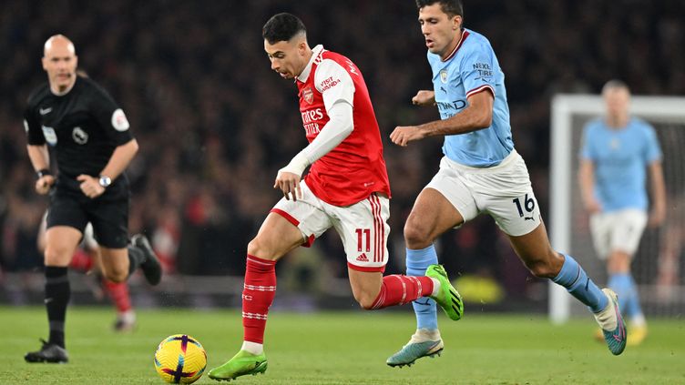 Gabriel Martinelli and Rodri in the duel during Arsenal-Manchester City, at the Emirates Stadium in London, April 15, 2023. (GLYN KIRK / AFP)