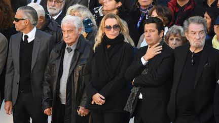 Jean-Paul Belmondo, Laurent Gerra, Eddy Mitchell sont aux Invalies pour l'hommage nationale à Charles Aznavour, le 5 octobre 2018. (ERIC FEFERBERG / AFP)