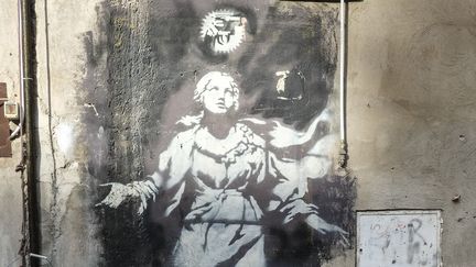 Détail de la Madone de Banksy
 (Yannis Vlamos/Sipa)