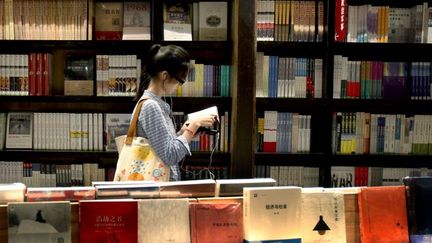 La solution à cette enquête non élucidée vieille de 22 ans se trouvait dans les pages d'un livre, écrite par l'auteur des faits sous les traits de la fiction.
 (LIU YING / XINHUA)