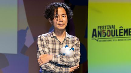 L'auteur japonais Hajime Isayama au 50e festival d'Angoulème, le 28 janvier 2023 (YOHAN BONNET / AFP)