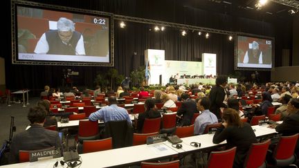 Les d&eacute;l&eacute;gu&eacute;s du monde entier d&eacute;battent tard dans la nuit du 9 au 10 d&eacute;cembre &agrave; la conf&eacute;rence sur le climat de Durban (Afrique du Sud). (ROGAN WARD / REUTERS)