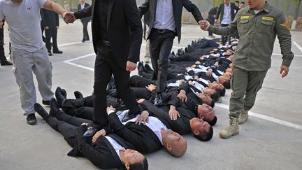 S&eacute;ance d'entra&icirc;nement dans un camp de formation de garde du corps &agrave; P&eacute;kin (Chine), le 2 novembre 2013. (REUTERS)