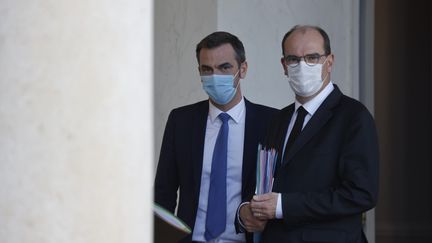 Le ministre de la Santé Olivier Véran et le Premier ministre Jean Castex à l'Elysée, le 14 octobre 2020. (LUDOVIC MARIN / AFP)