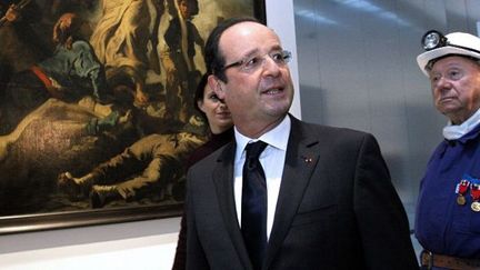 François Hollande et Lucien Laurent, un ancien mineur, devant &quot;La Liberte Guidant le Peuple&quot;
 (MICHEL SPINGLER / POOL / AFP)