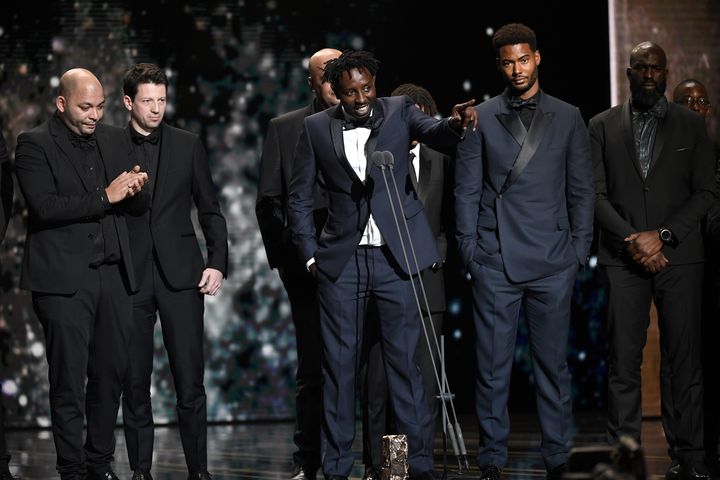 Le réalisateur Ladj Ly lors de son allocution après l'annonce du César du meilleur film pour "Les Misérables". De gauche à droite : les producteurs Toufik Ayadi et Christophe Barral, le réalisateur Ladj Ly et l'acteur Djebril Zonga.. (BERTRAND GUAY / AFP)